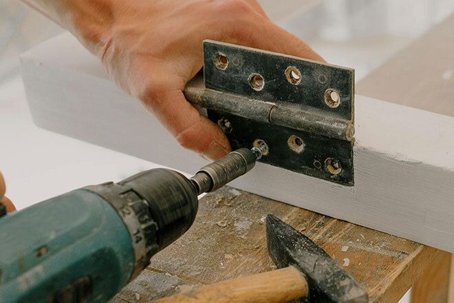 Drilling door hinge in place
