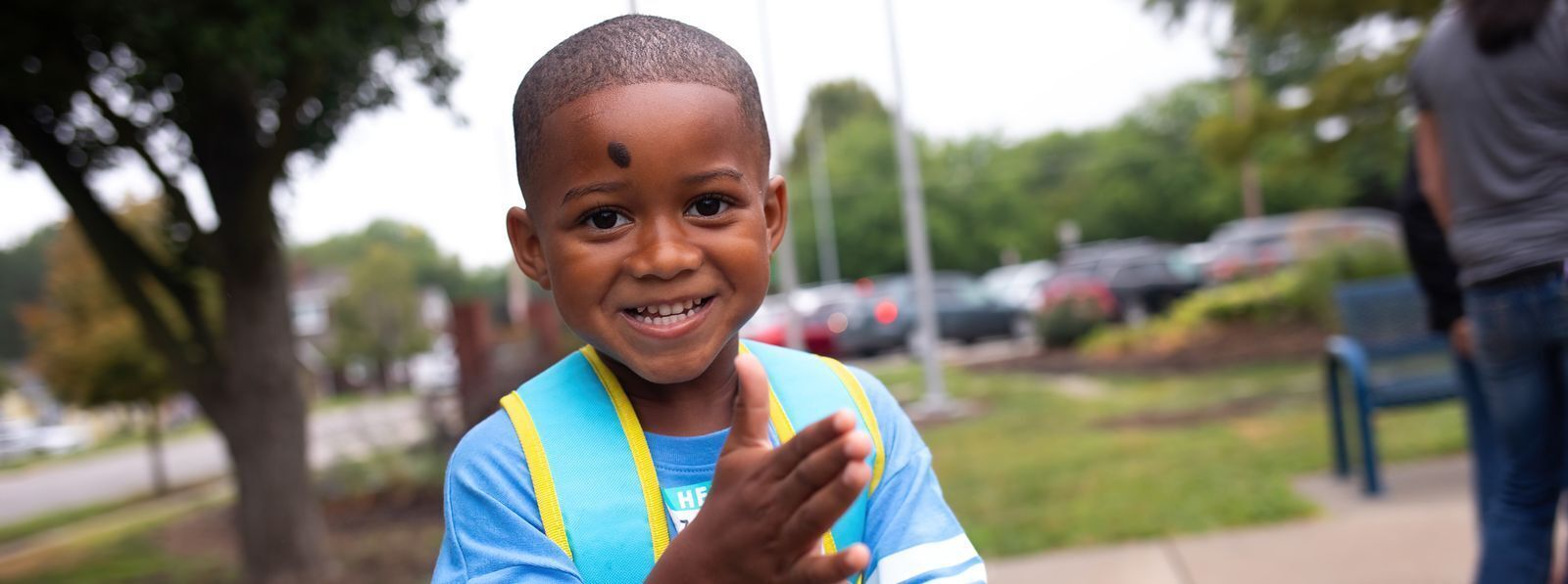 Little boy smiling on this first day of school