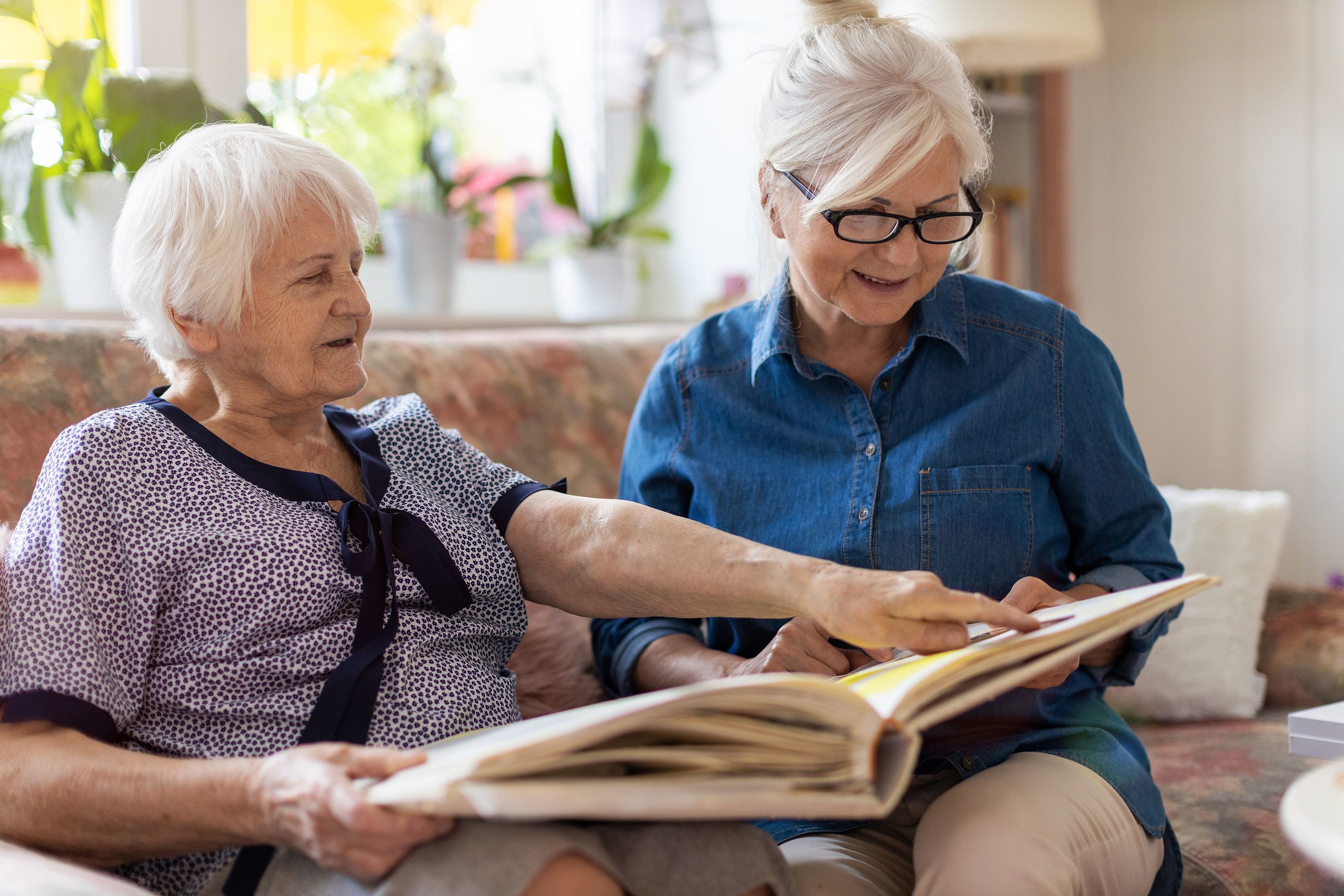 Caregiver adult daughter visits with her mother