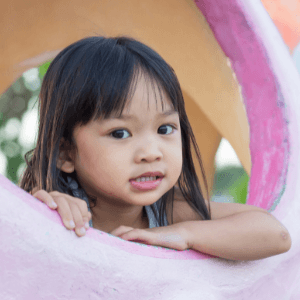 Image of a young child smiling at the camera.