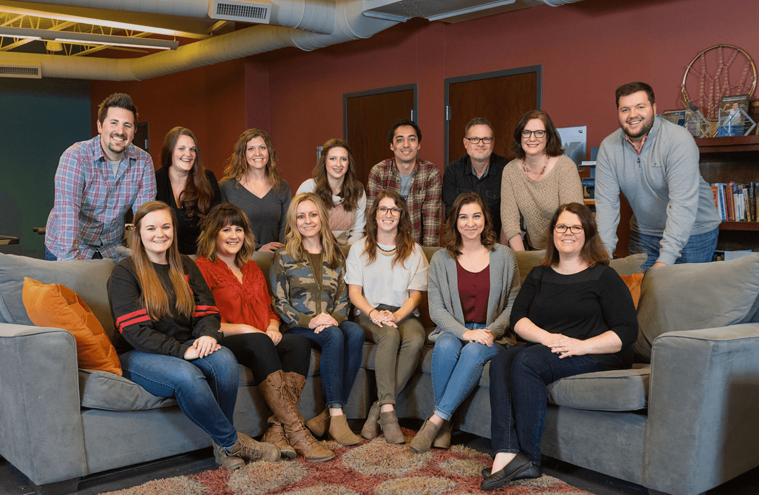picture of staff on and around a couch