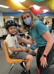 Kid wearing a helmet.