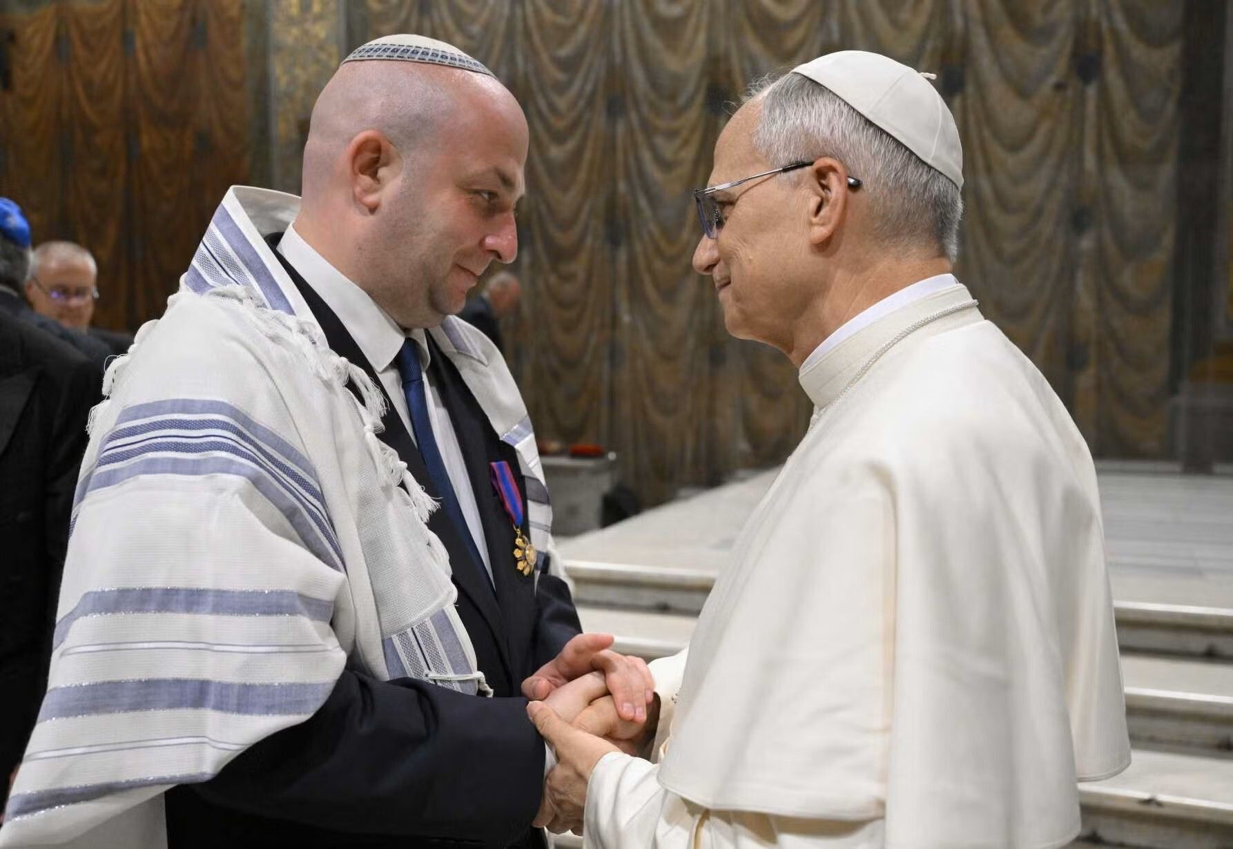 Pope Leo XIV greets Silviu Vexler, president of the Federation of Jewish Communities in Romania, during a ceremony honoring Blessed Iuliu Hossu in the Sistine Chapel at the Vatican June 2, 2025. (CNS photo/Vatican Media)