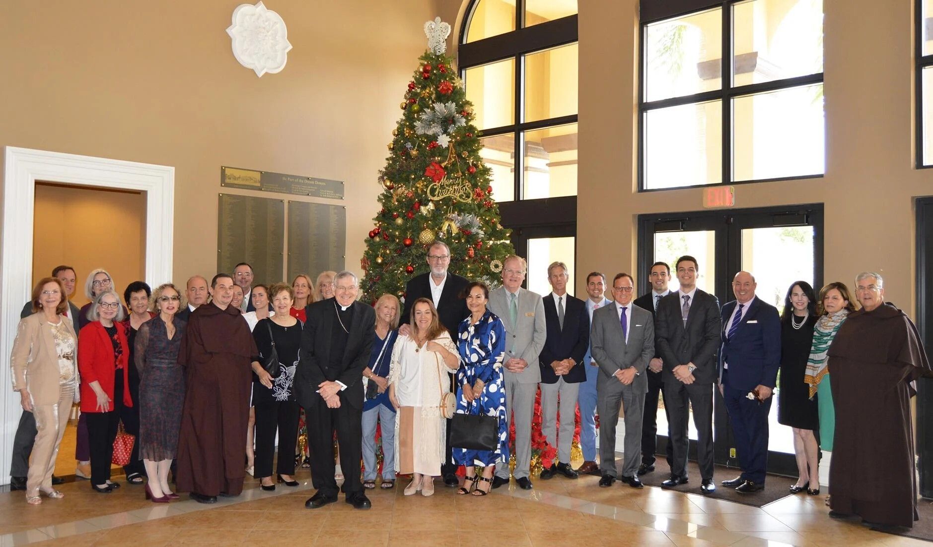Following Mass, Bishop Gerald M. Barbarito poses for a photo with the Catholic Realtors group at St. Jude Parish in Boca Raton.