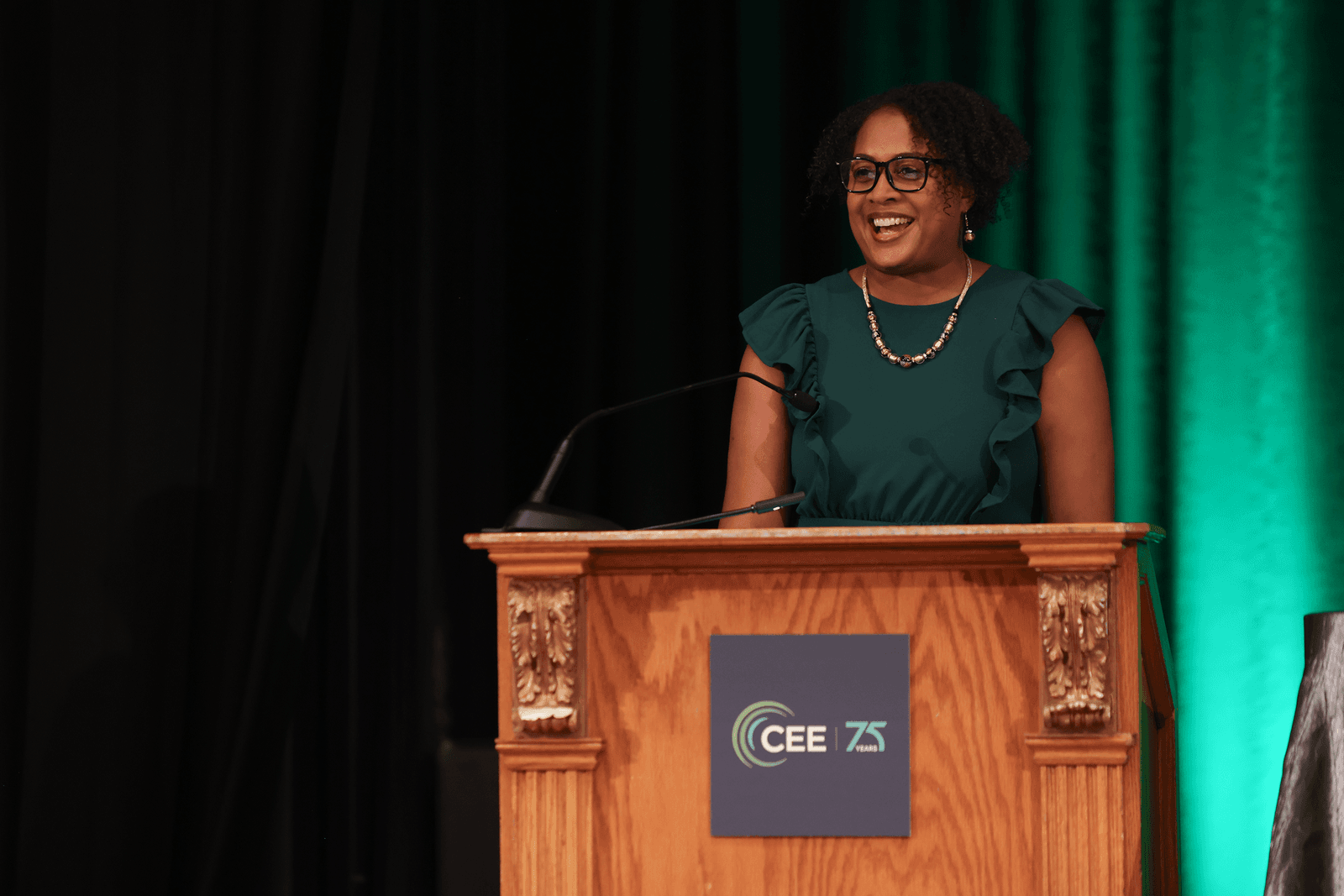 woman speaking at a podium