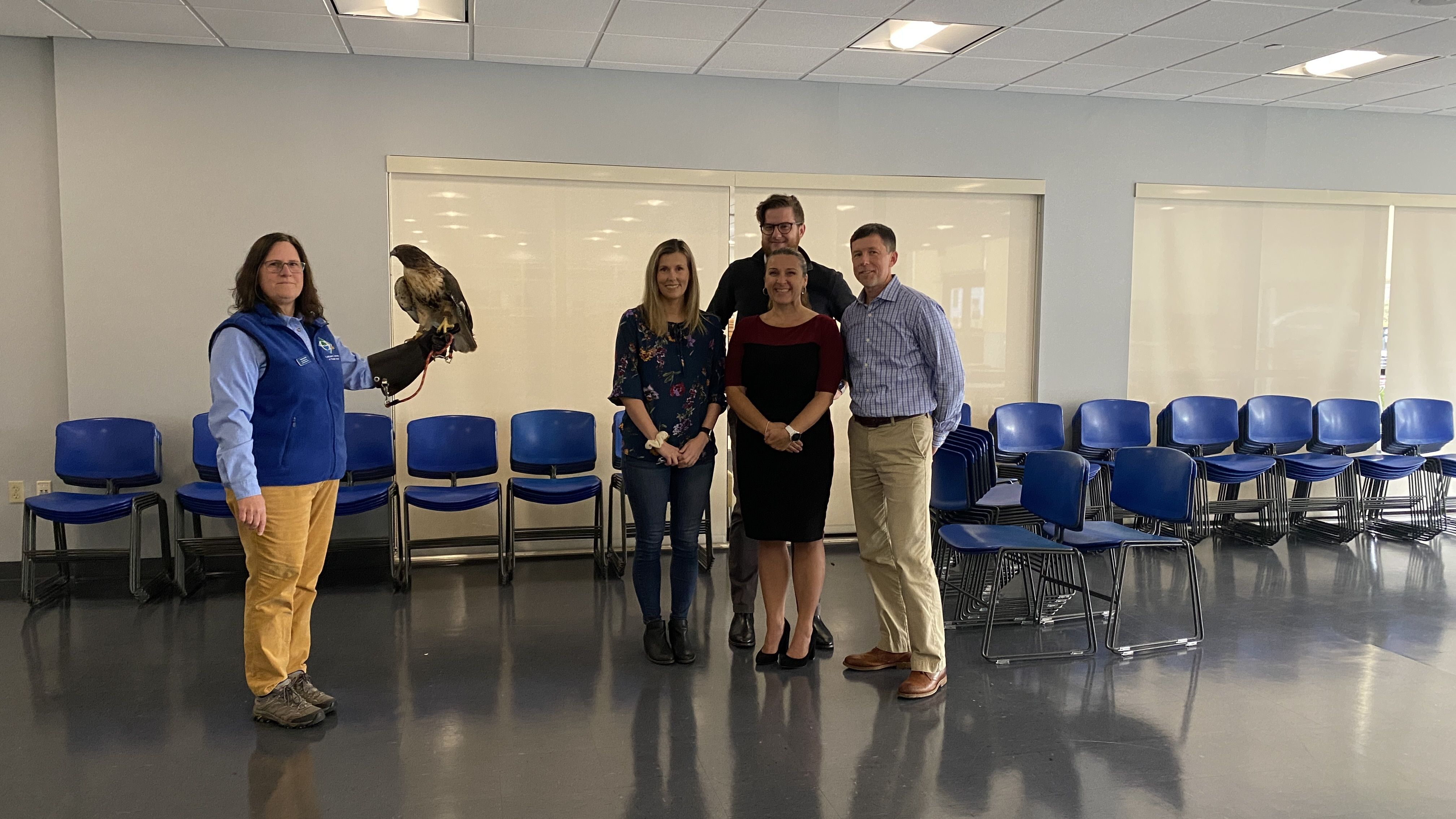 Audubon Educator Marina, Lady Hawk the Red-tailed Hawk and Bank of America employees