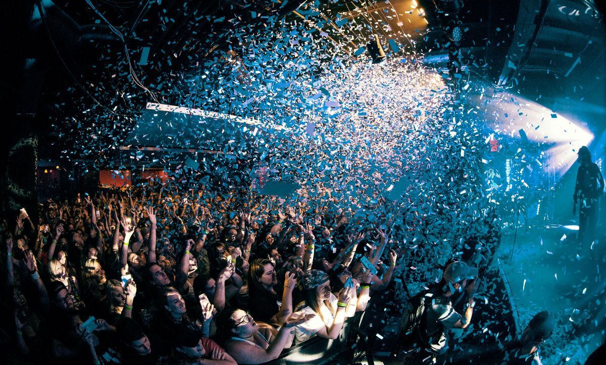 Image of a party with confetti flying 
