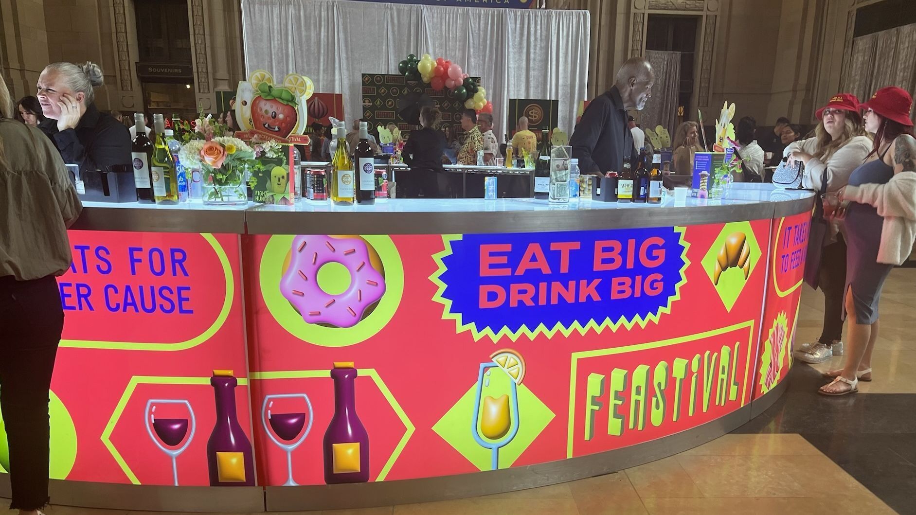 Round bar with backlit image wrap and people and drinks