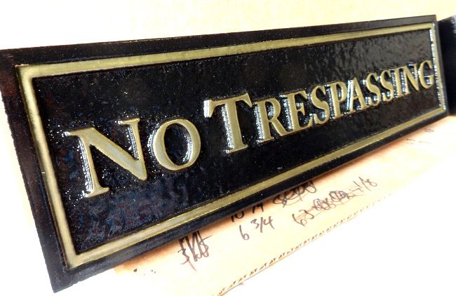 I18987 - Carved No Trespassing Sign with Raised Text and Border Painted Metallic Gold , and Glossy Finish (Side View)