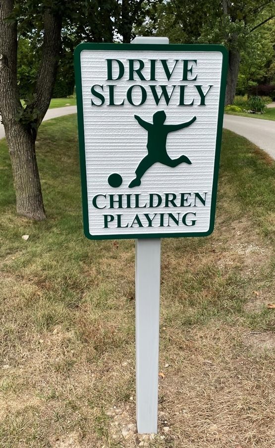 H17213 Carved and Sandblasted HDU "DRIVE SLOWLY - Children  Playing" Sign, with Stylized Running Child  as Artwork, Mounted on Wood Post