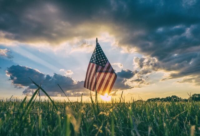 american flag at sunset