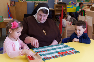 Felician Sister with children