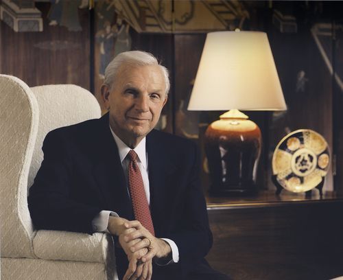 Henry W. Bloch smiling in his office chair