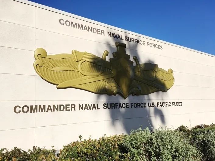 TA1040 - 24 ft wide carved wall plaque mounted on an outside wall of the Headquarters building of the  Commander of Surface Naval Forces,  Pacific Fleet