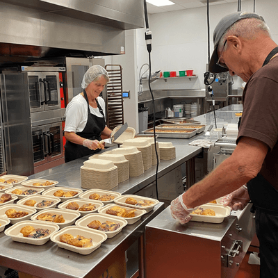 Volunteers preparing food in the Redwood Empire Food Bank kitchen