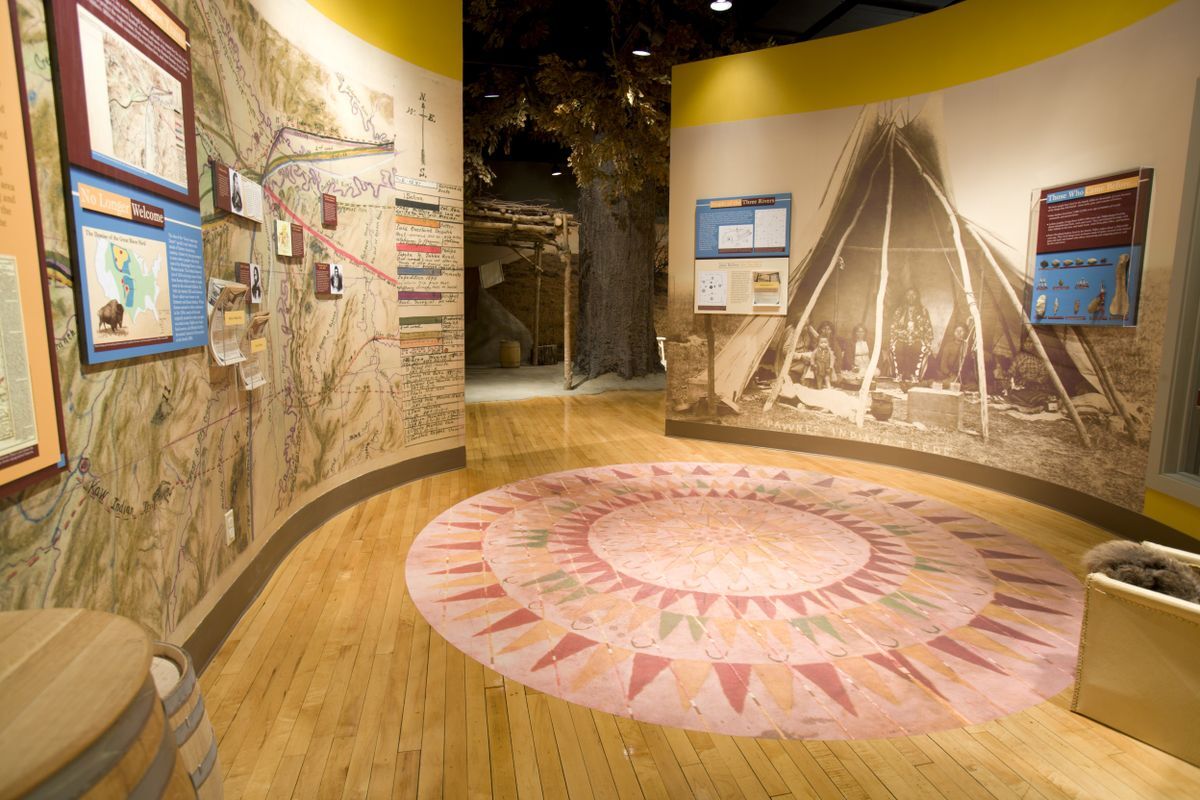 Display showing the image of a tipi at the Smoky Hill Museum.