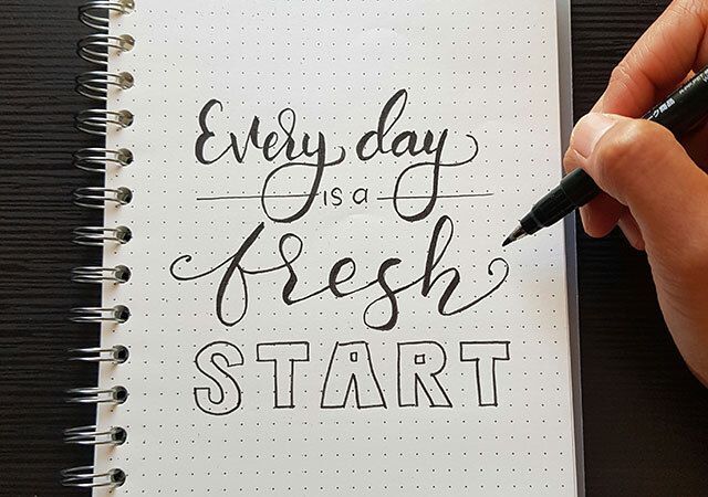Inspirational quote, every day is a fresh start, written on paper.