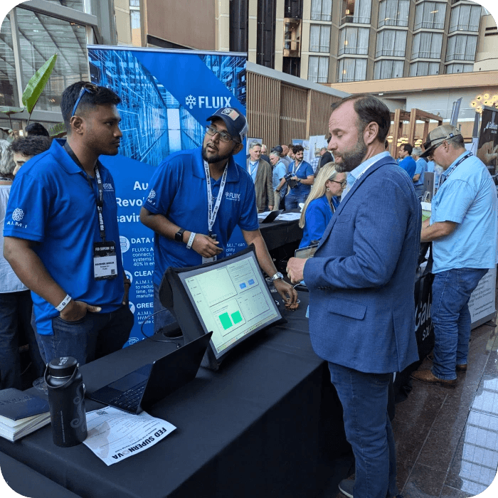 image of a man standing next to a portable display at a tradeshow