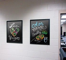 Chalk art food images on a school wall in a flip open frame, food posters, nutrition education