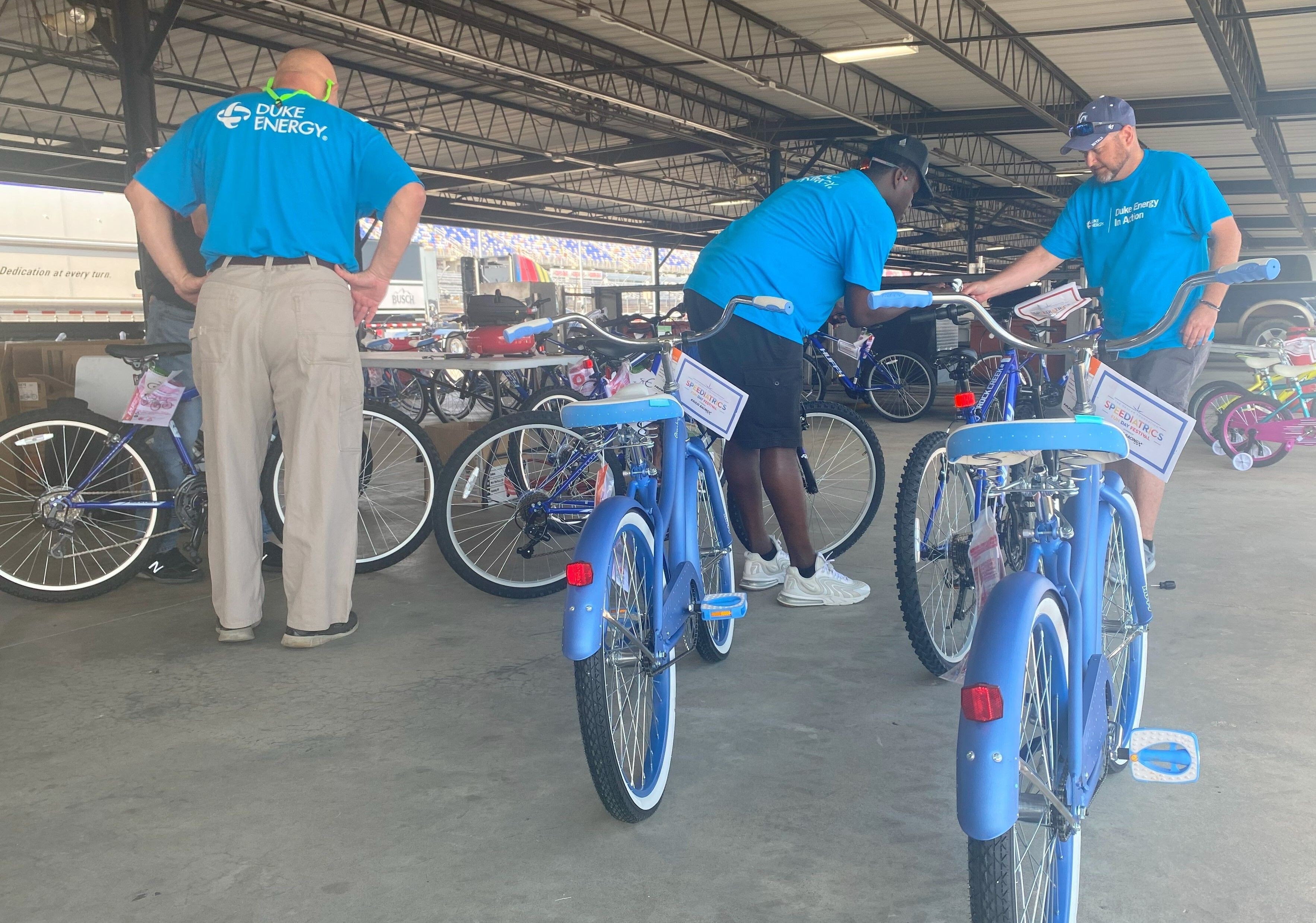 Volunteers assemble donated bicycles for member of the Boys & Girls Clubs of the Pee Dee Area.