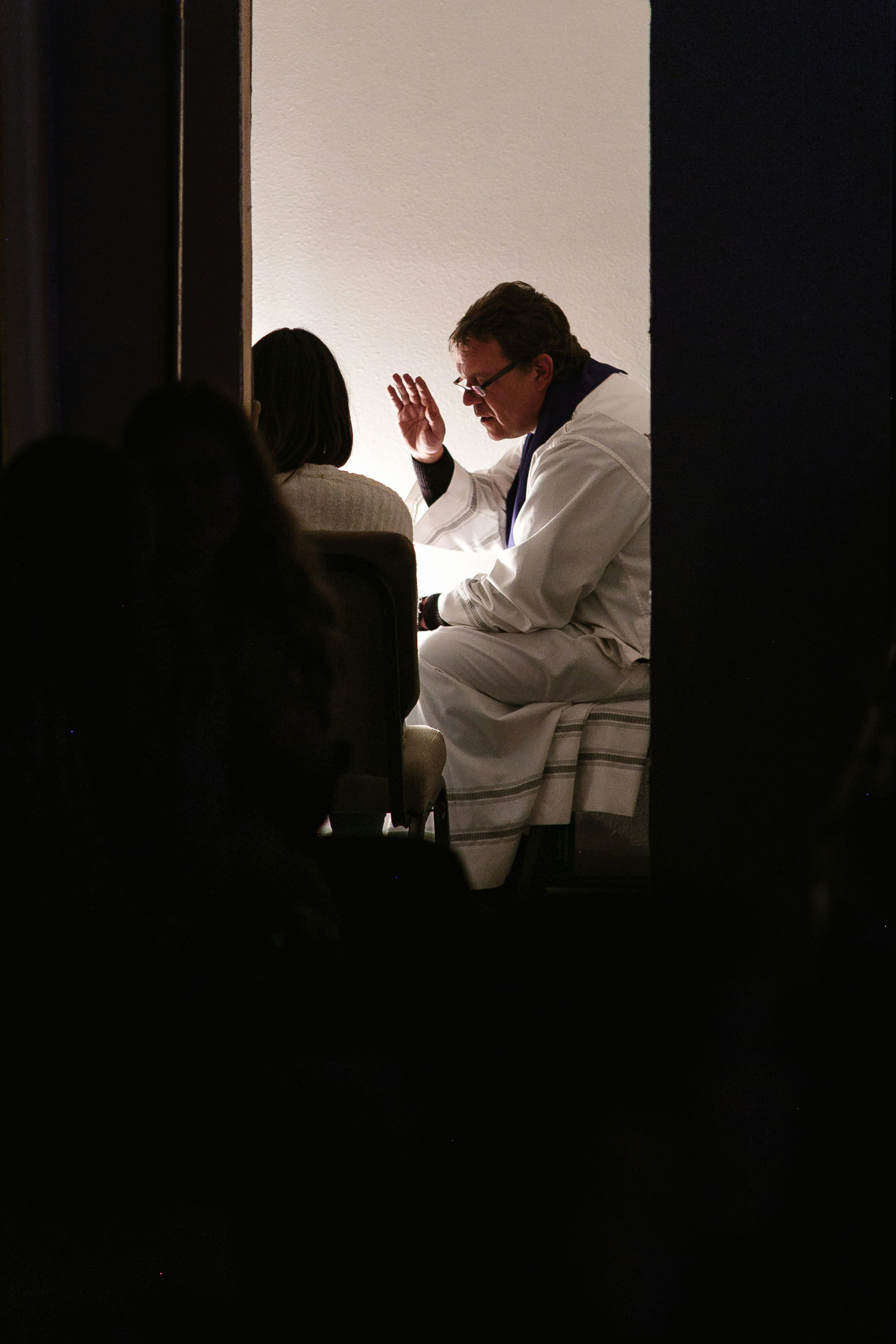 Preist and parishioner in confession