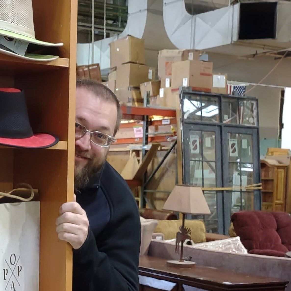 Store Manager Cody peeking around a corner during the ReStore remodel.