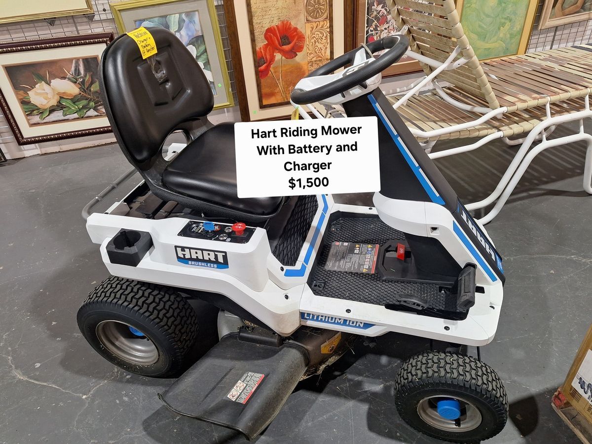 Hart battery-powered riding lawn mower with seat, charger, and lithium-ion battery available at Habitat ReStore – $1,500