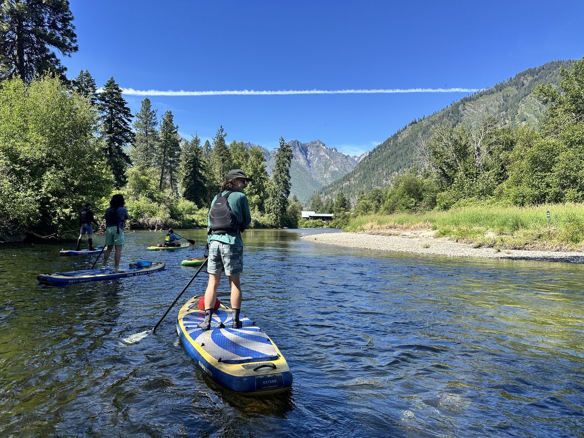 Picture of a man on a paddle board on the Wenatchee River.