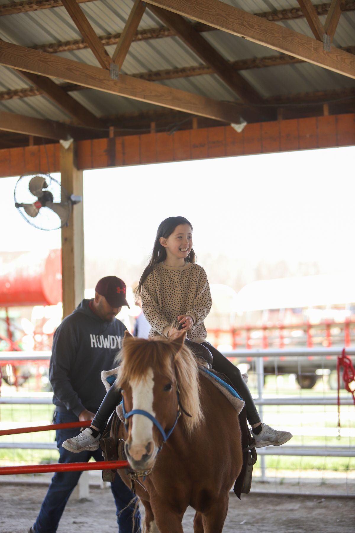 Child riding a pony at Faulkner's ranch