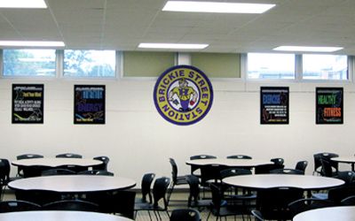 School café showing health and fitness posters, black, flip open frames, custom signs
