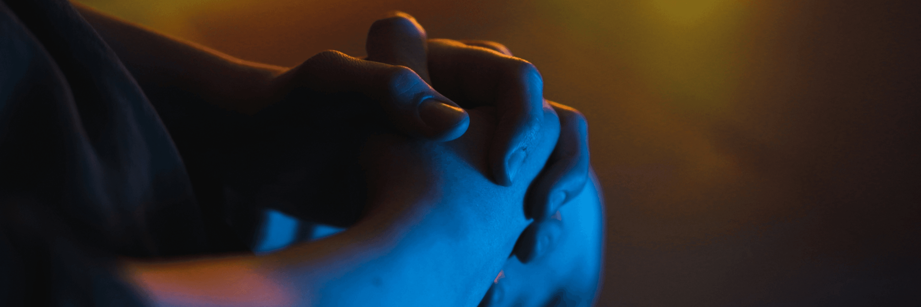 Photo of hands clasped in prayer