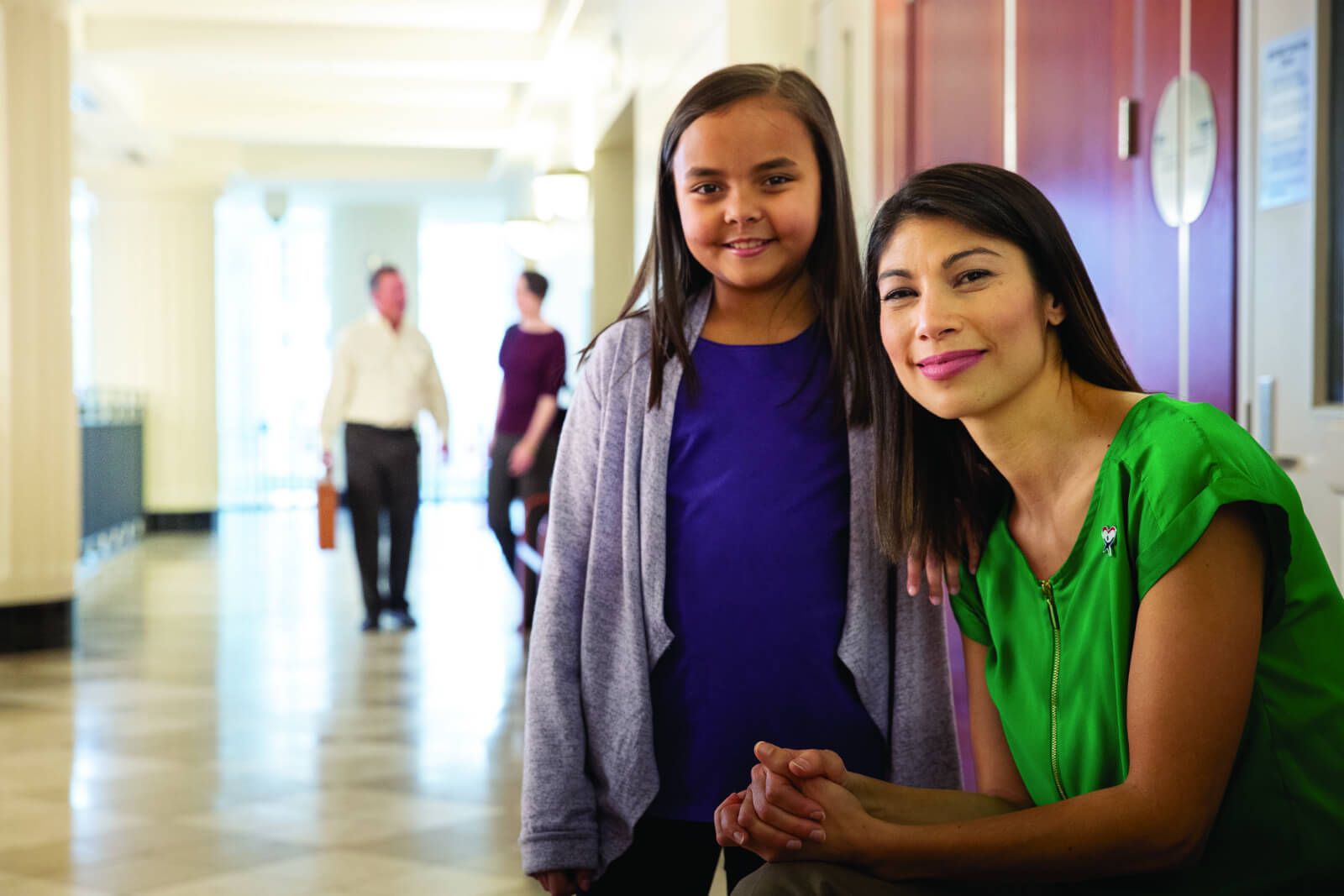 Girl living in foster care pauses with her CASA volunteer