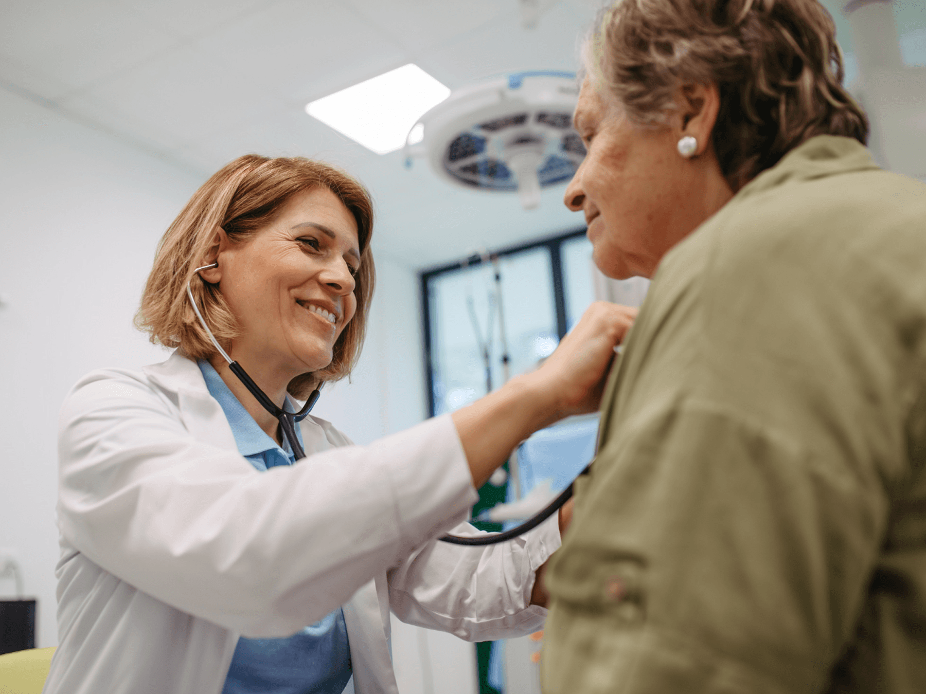 physician smiling at female patient
