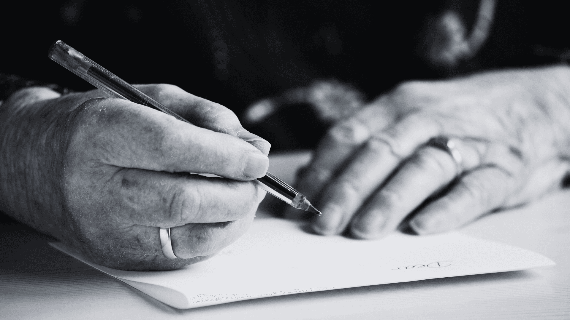 man hand writing a letter