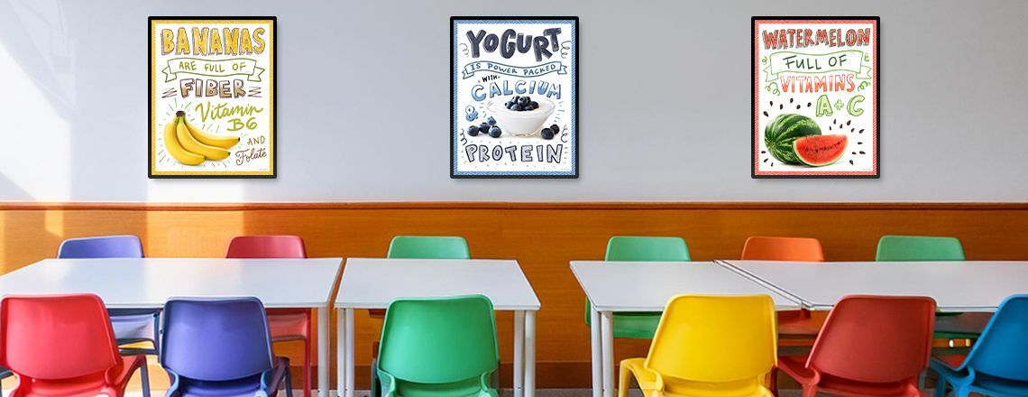 School café serving line with 2 food education posters on wall, white posters with nutrition facts