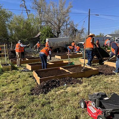 Volunteers digging and setting up the community garden.