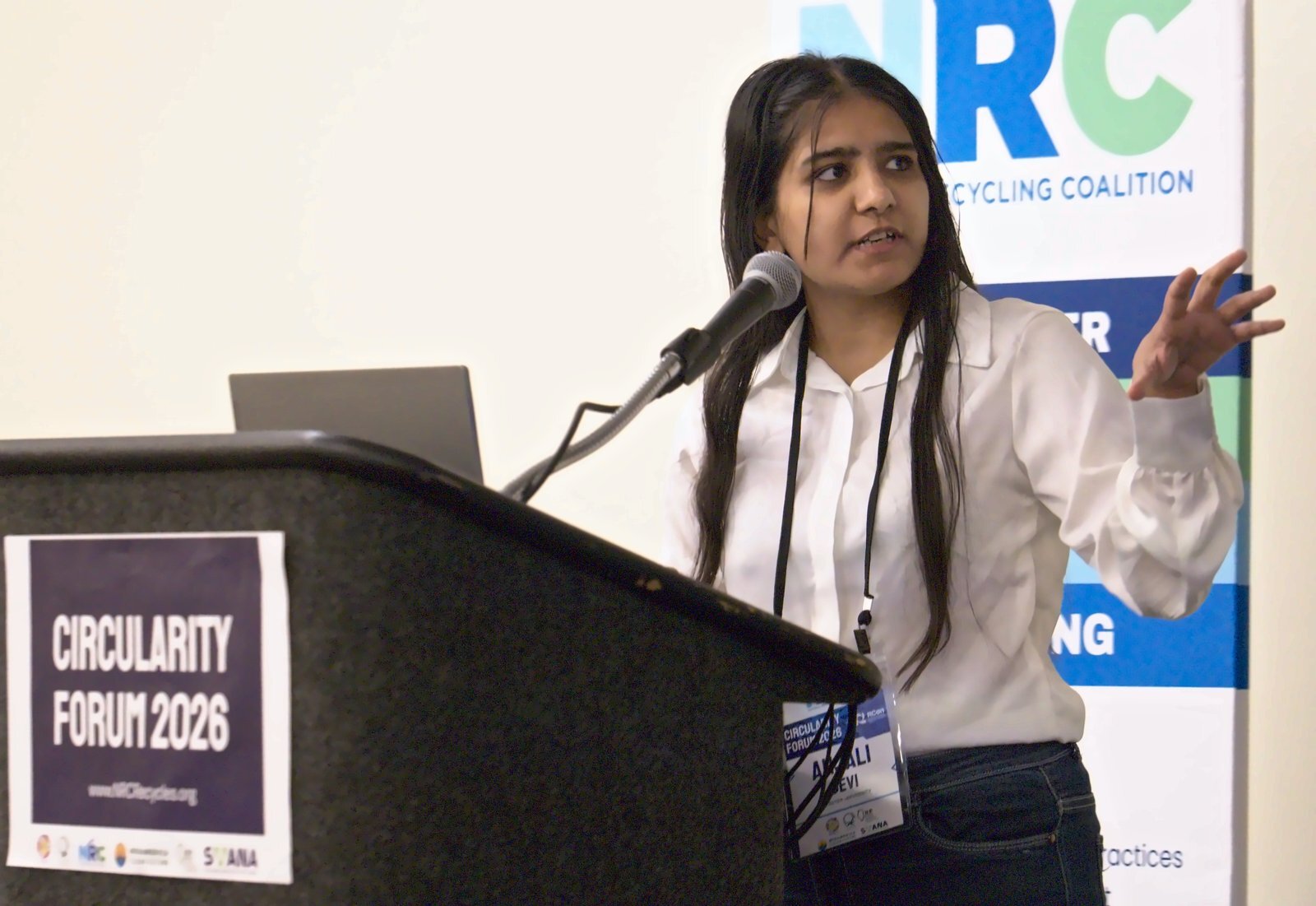 Anjali Devi presents at the Circularity Forum podium beside an NRC banner.