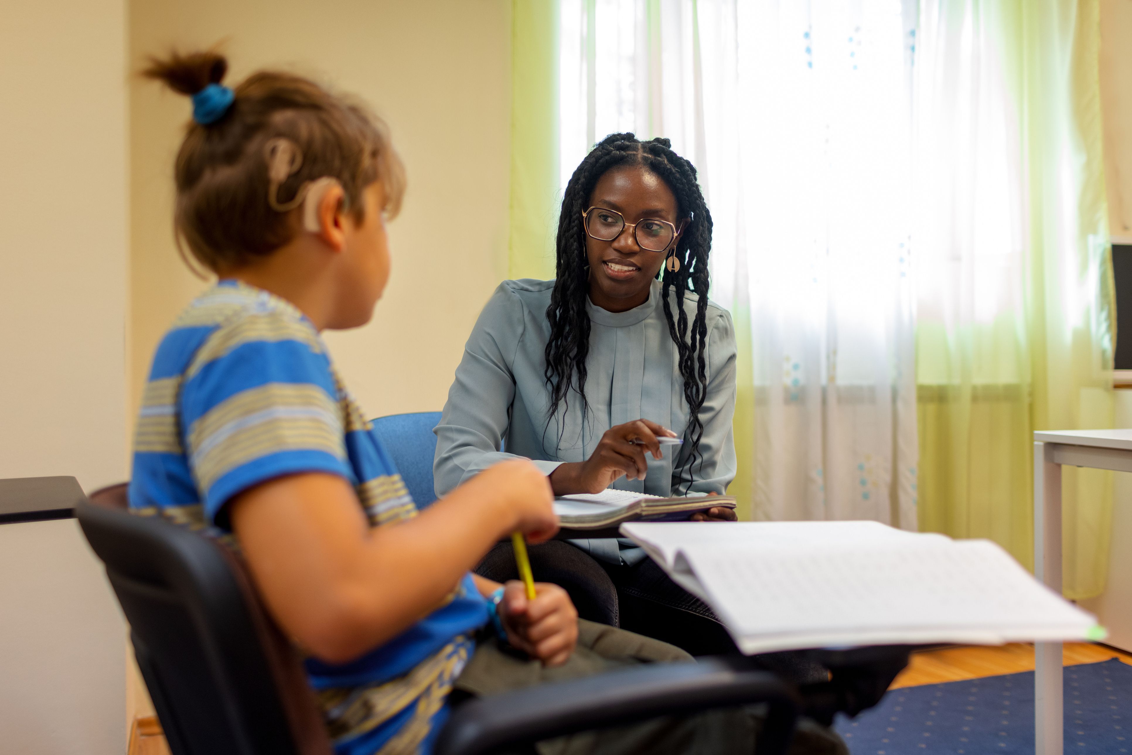 Adult working together with a young child.