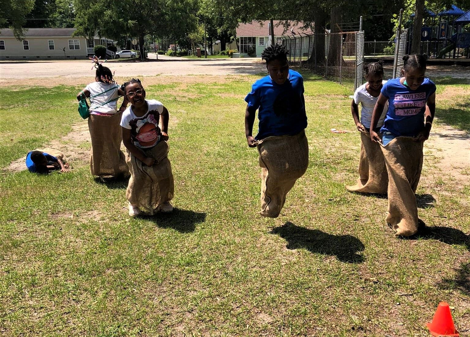 Kids participating in a sack race