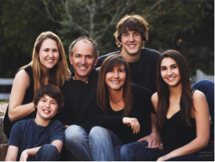 Photo of the Corderman family: Mother, father, two daughters, two sons