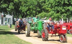 Tractor parade through the historic village.