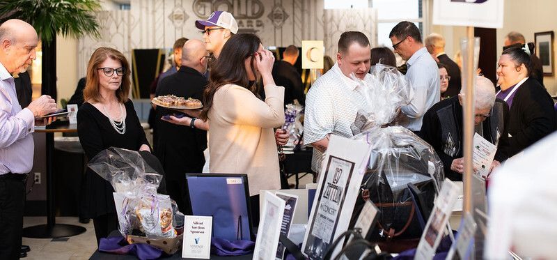 Guests shop silent auction items