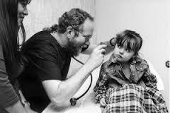 Medical Professional Examining Little Girl Ear