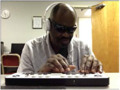 A picture of Willie Bivins using iCanConnect equipment 