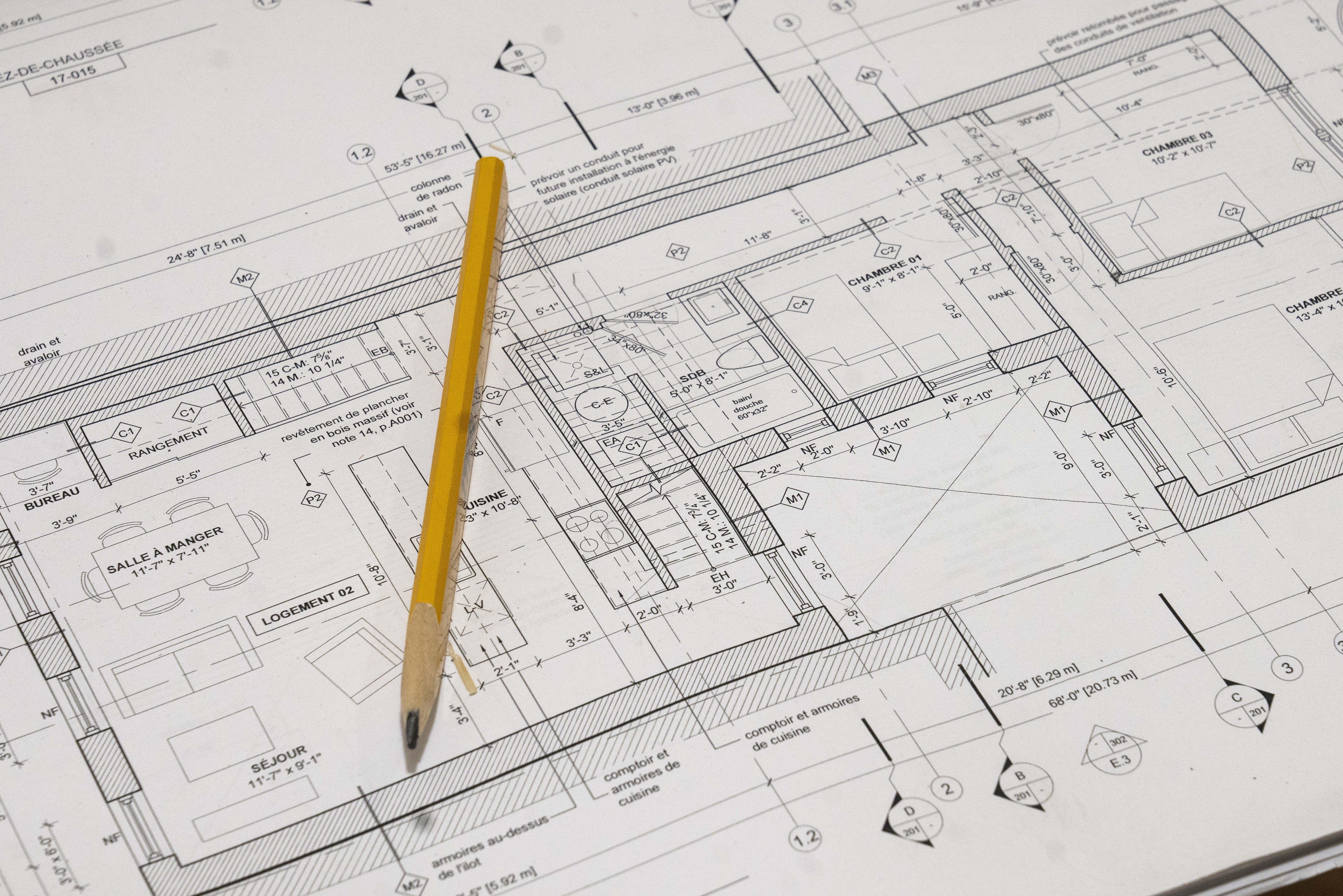 A blueprint with a pencil