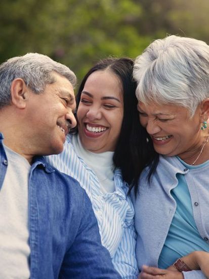 Family of three – Father, 20 year-old Daughter, Mother, close, smiling