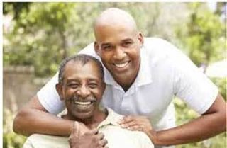 Son and dad smiling.