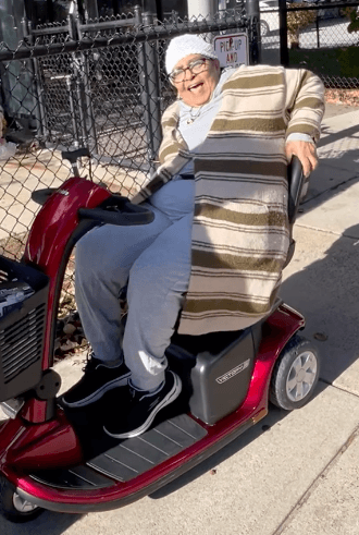 Program Participant Abeba testing a new Scooter