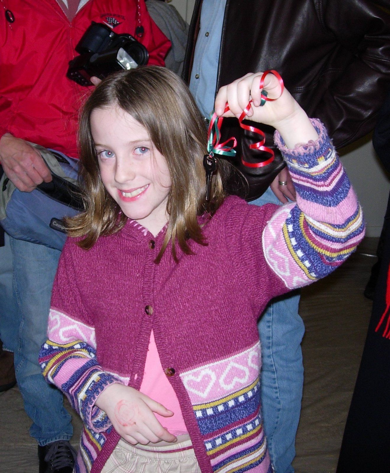 Child holding keys of newly built house