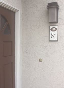 KA20982 - Apartment Number Sign Installed on Wall Adjacent to Door